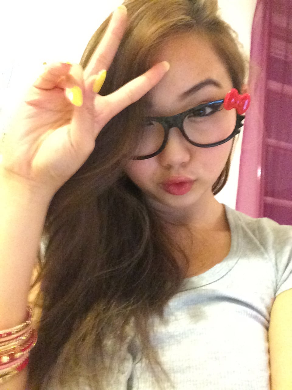 Peace sign in hello kitty glasses